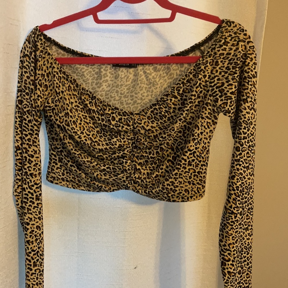 Cheetah off the shoulder Roche top